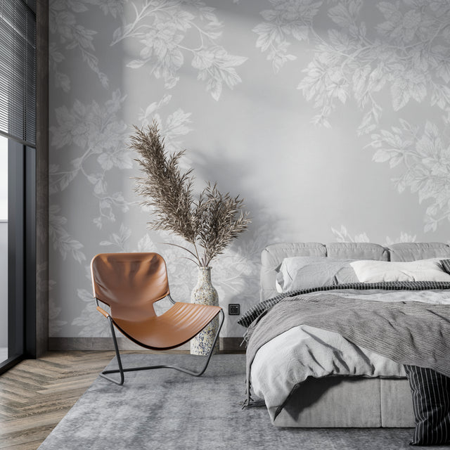 Grey floral wallpaper creating a peaceful atmosphere in a modern living room with natural light