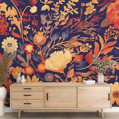 Navy and gold floral wallpaper in a bright living room, showing botanical pattern with golden blooms against deep blue background