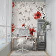 Red poppies floral wallpaper in modern living room with grey sofa and natural light
