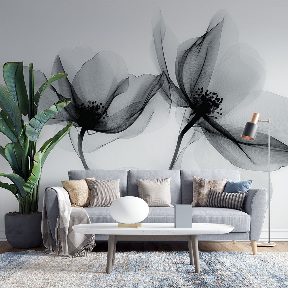 Black and white floral wallpaper creating an elegant atmosphere in a modern living room with natural light