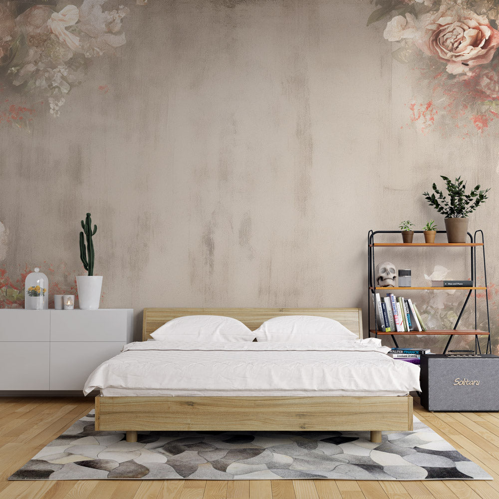 Vintage rose wallpaper mural in a bright living room, showing soft coral and beige tones against white furniture