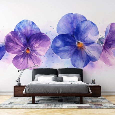 Purple and blue pansy wallpaper in bright modern bedroom, showing watercolor floral mural creating peaceful atmosphere