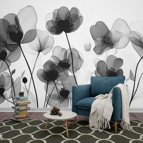 Black and white floral wallpaper creating dramatic contrast in a minimalist living room setting