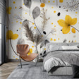 Yellow and grey floral wallpaper brightening a modern living room with natural light
