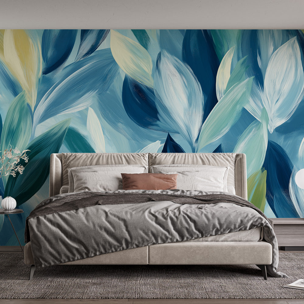 Modern blue and yellow leaf wallpaper mural in a bright living room with minimal furniture, showing how abstract leaves create depth