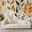 Autumn leaves wallpaper mural creating a cozy atmosphere in a modern living room with soft lighting and minimal furniture