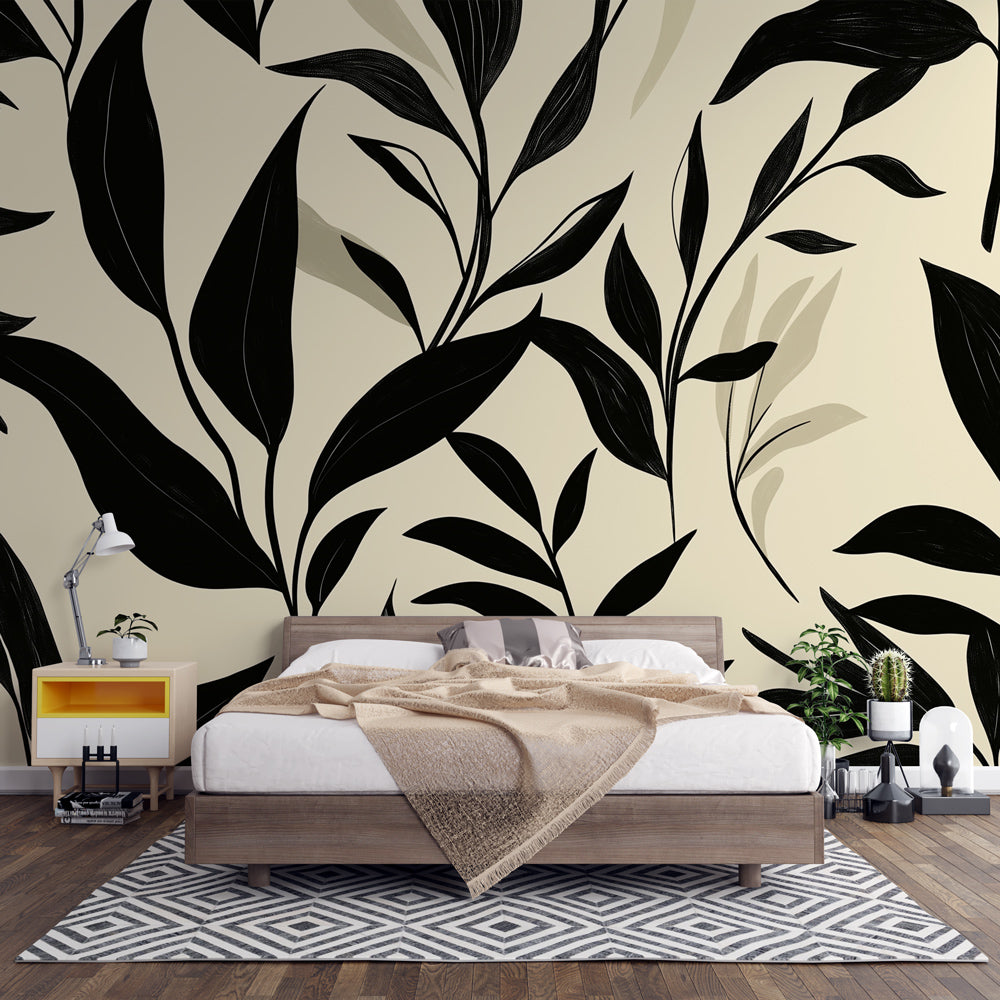 Black and beige botanical wallpaper mural styled in a modern living room with minimal furniture