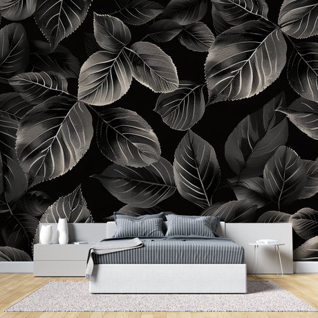 Black and silver leaf wallpaper creating drama in a modern living room setting