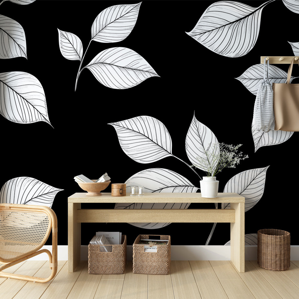 Black and white botanical line art wallpaper creating a stunning focal point in a minimalist living room setting