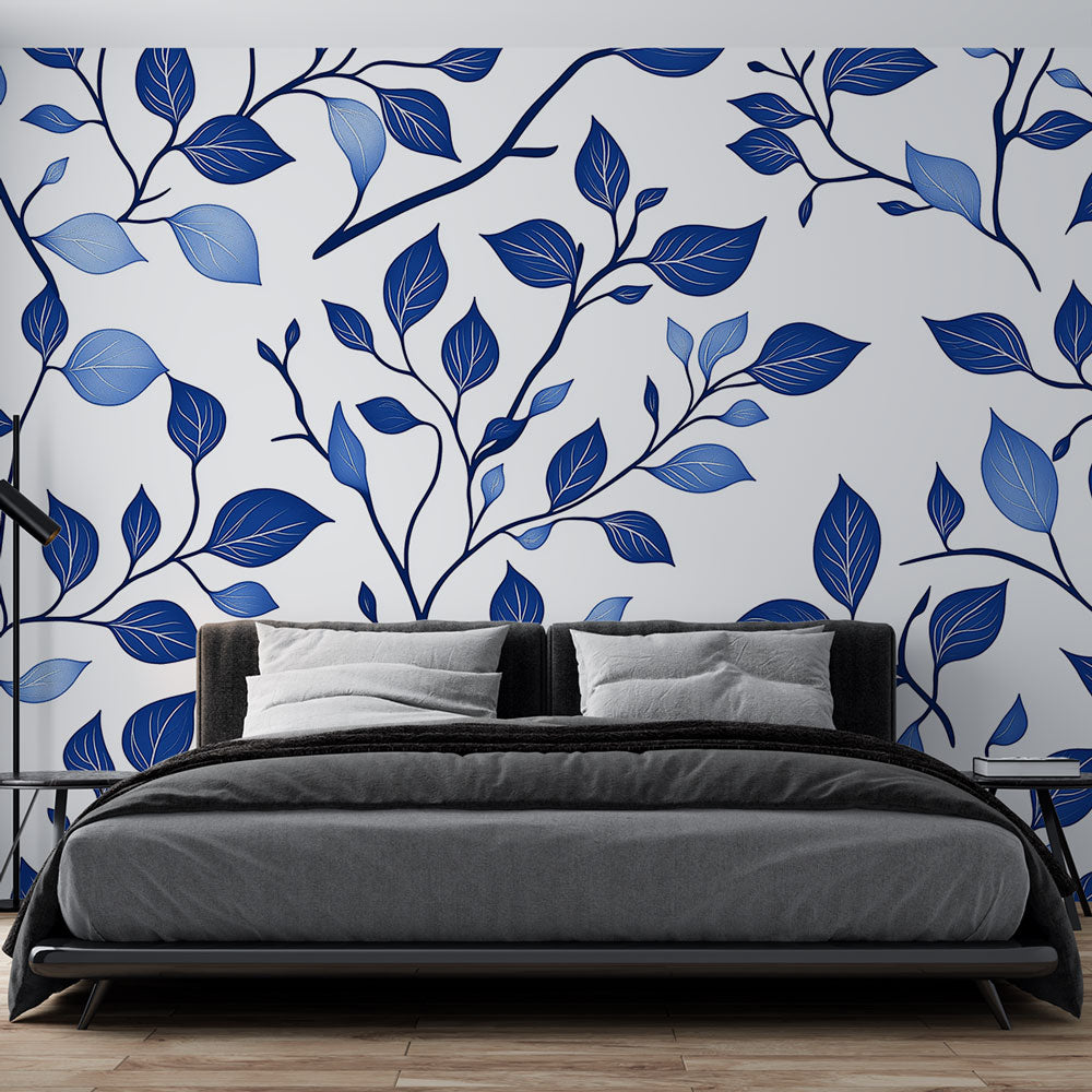Blue botanical wallpaper mural bringing fresh style to a modern living room with white furniture and natural light