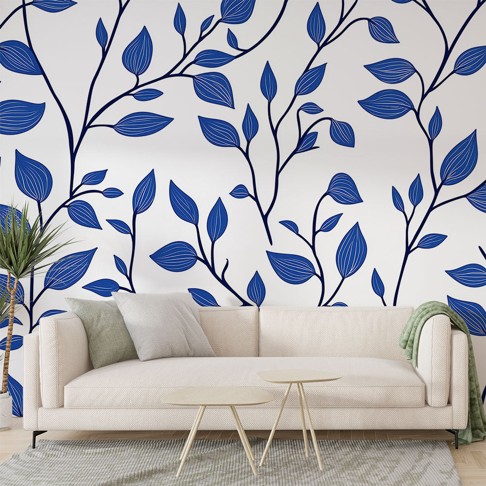 Blue botanical wallpaper creating a calm atmosphere in a modern living room with natural light
