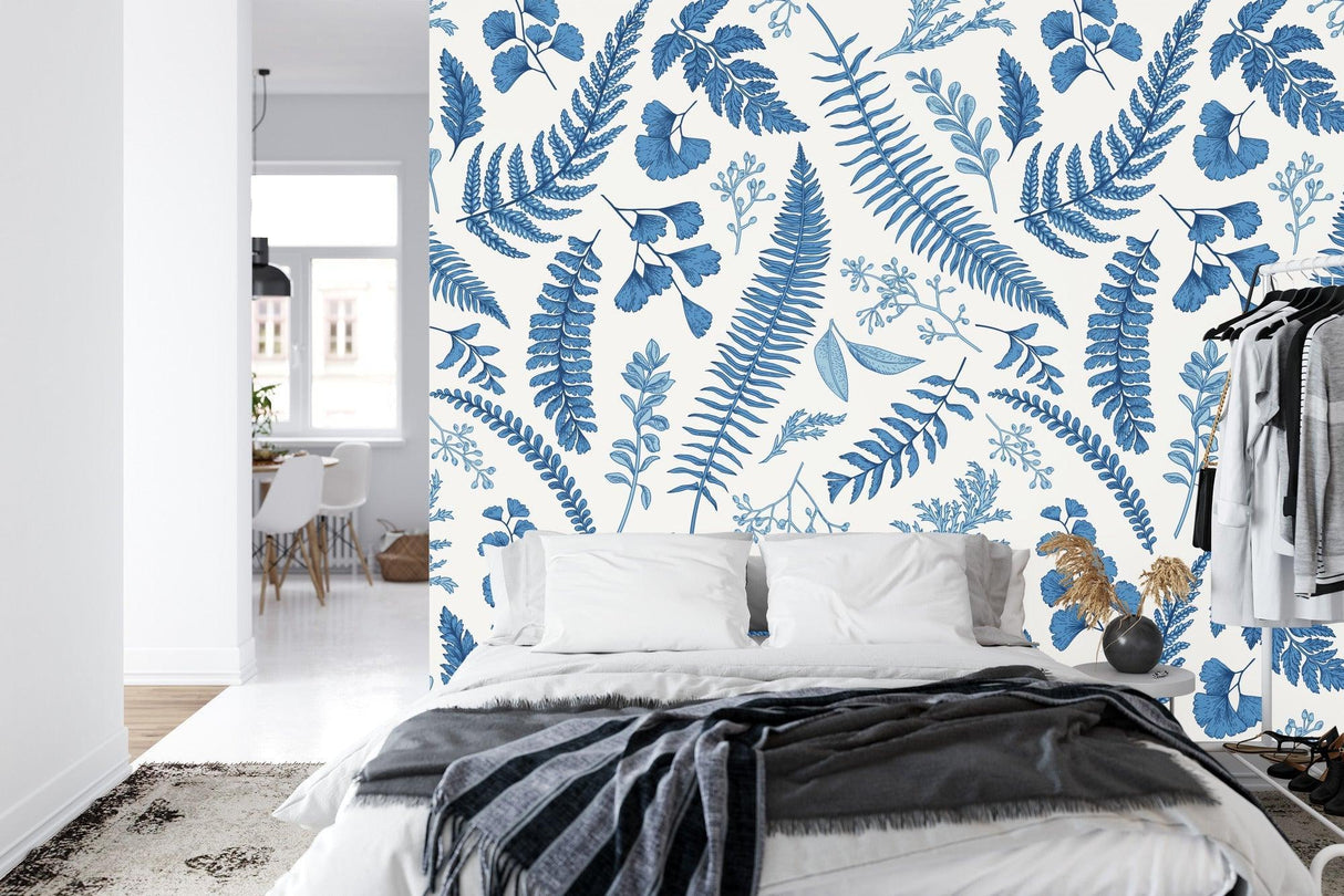 Blue fern botanical wallpaper in a bright modern living room, creating a fresh and natural atmosphere