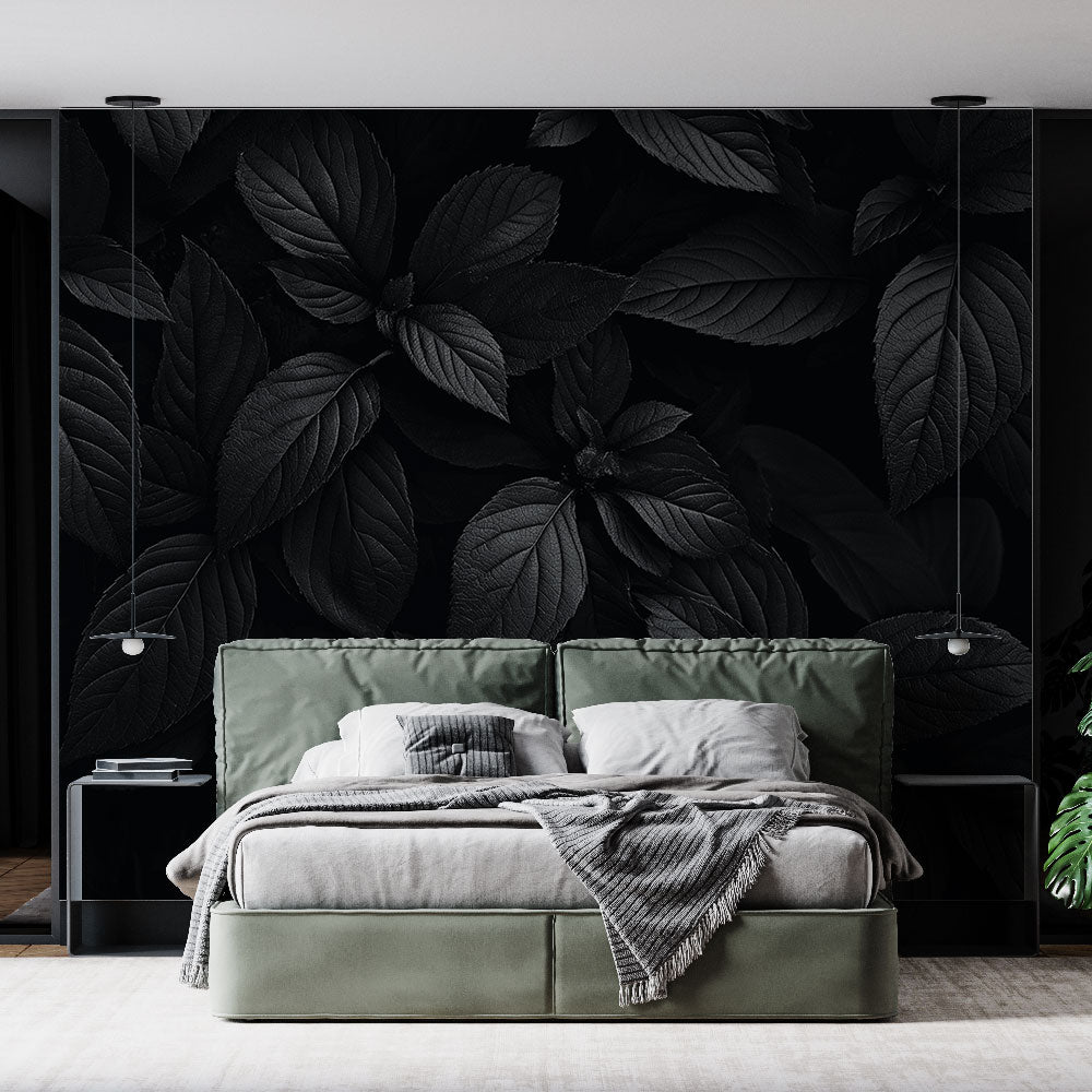 Black botanical wallpaper creating dramatic atmosphere in modern living room with grey sofa and minimal decor