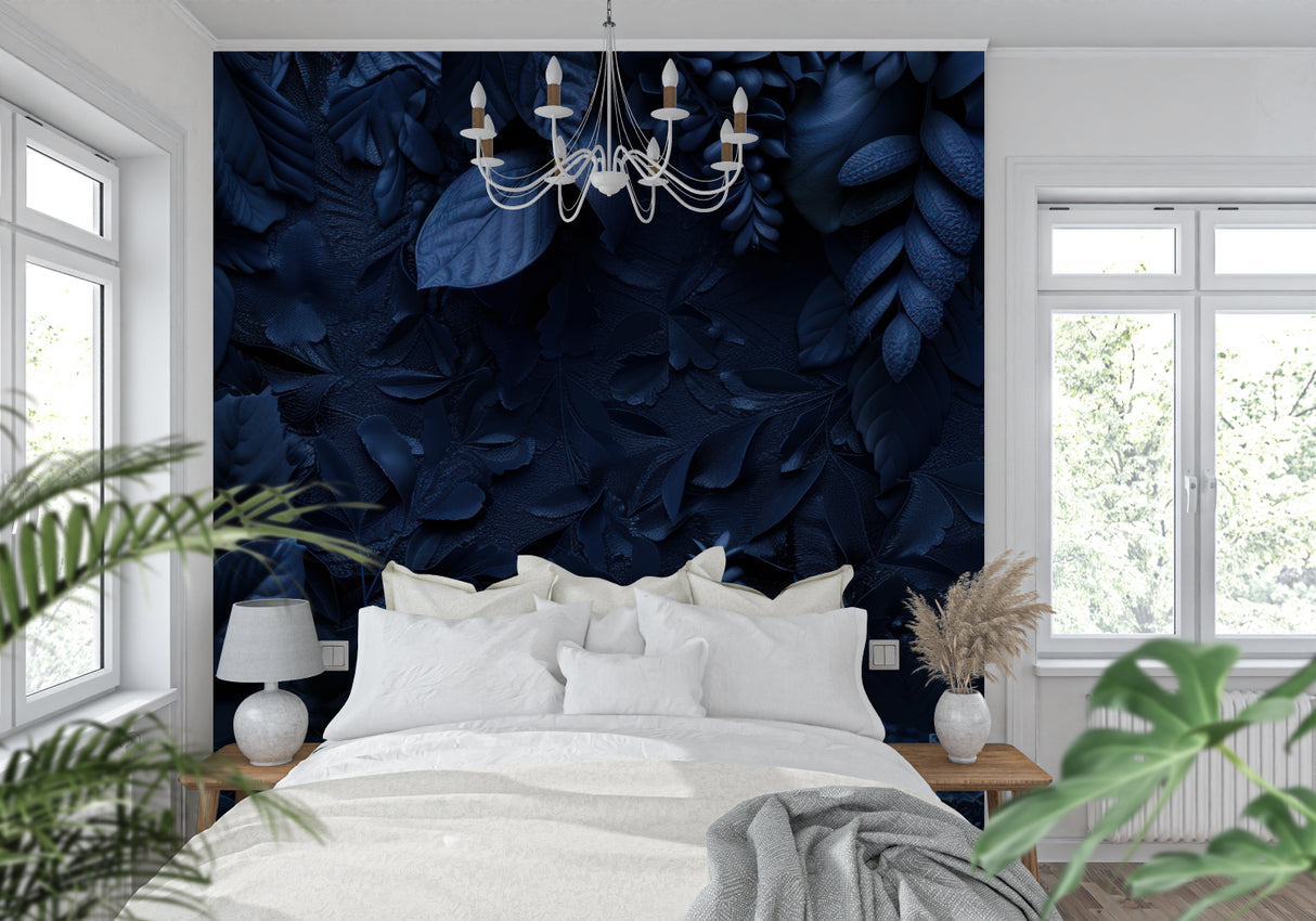 Deep blue textured leaf wallpaper in modern living room with gray sofa and natural light