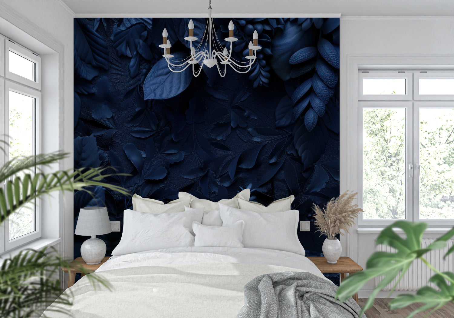 Deep blue textured leaf wallpaper in modern living room with gray sofa and natural light