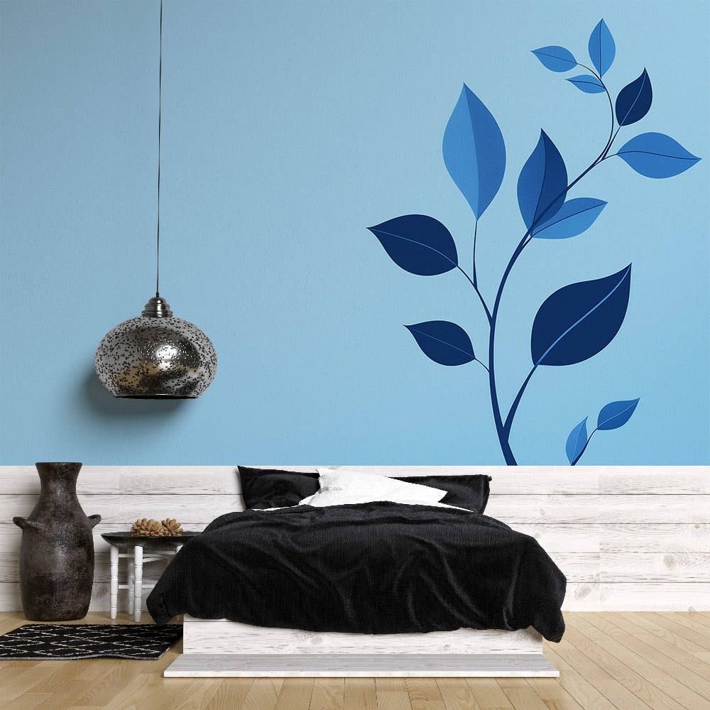 Minimalist blue leaf wallpaper creating a peaceful atmosphere in a modern living room with natural light and clean lines