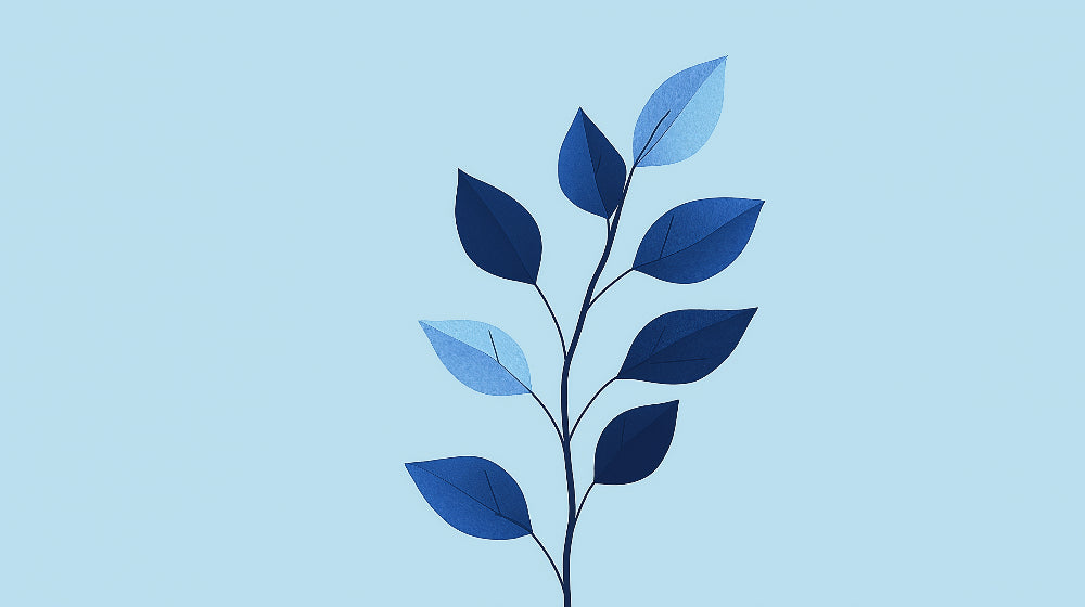 Modern blue leaf wallpaper mural creating a calm atmosphere in a bright living room with minimalist furniture