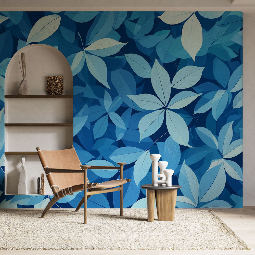Blue tropical leaf wallpaper in a modern living room, creating a fresh and calm atmosphere with its flowing pattern