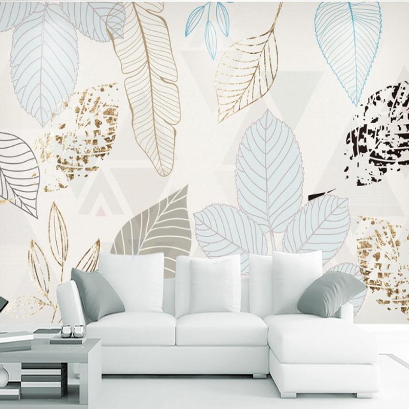 Contemporary foliage wall mural enhancing a modern home office with metallic accents