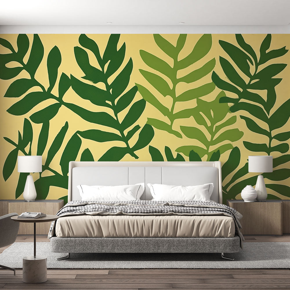 Modern green leaf wallpaper in bright living room showing scale and impact of botanical design against white furniture