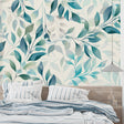 Turquoise and sage botanical wallpaper in modern living room with grey sofa and natural light