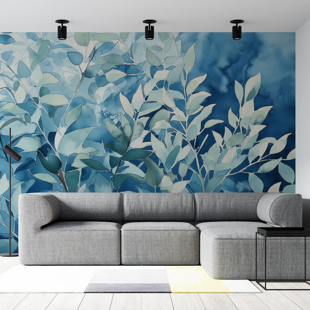 Blue watercolor leaf wallpaper creating a calm atmosphere in a modern living room with natural light