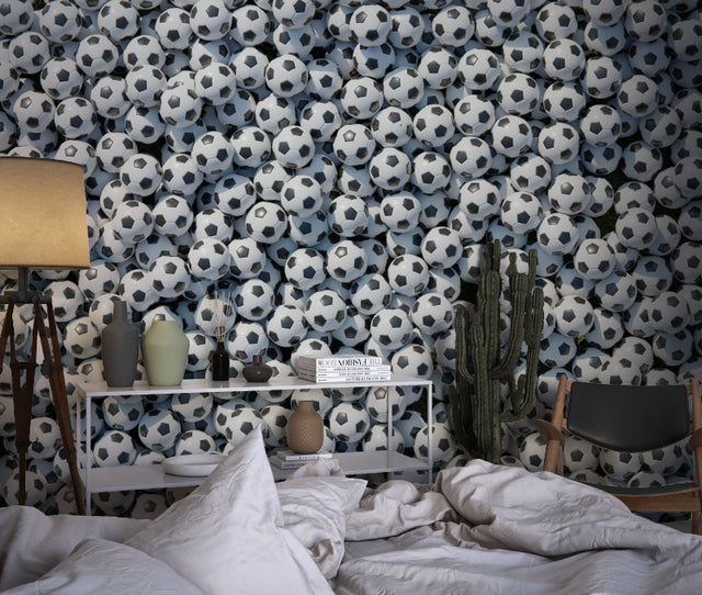 Football wallpaper bringing sporty style to modern teen bedroom with gaming setup