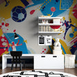 Football mural wallpaper bringing energy to modern kids bedroom with blue and yellow dynamic design