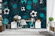 Football wallpaper mural creating sporty atmosphere in modern teen bedroom with gaming setup and blue accent lighting