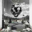 Football balloon wallpaper in modern teen bedroom showing black and white design with dramatic lighting