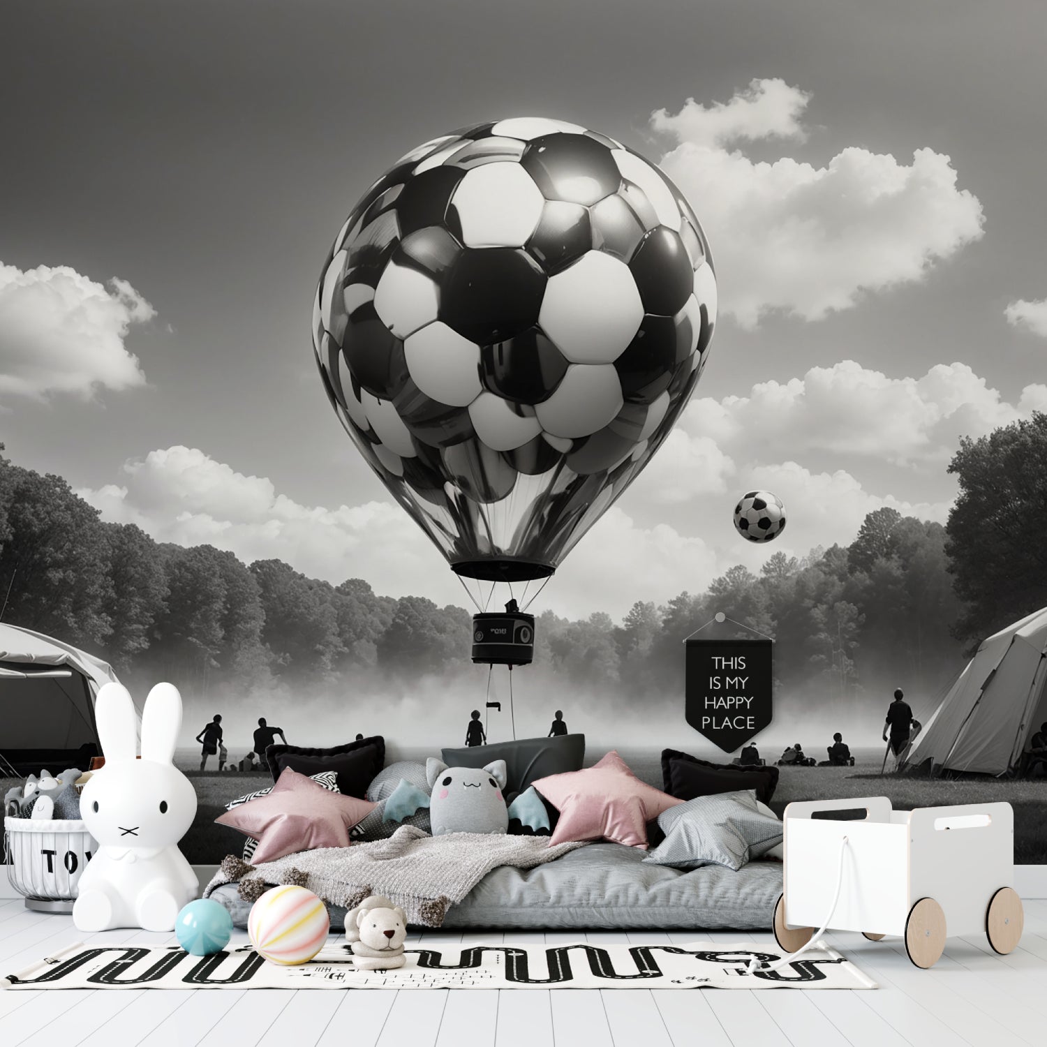 Black and white football mural displayed in spacious living room with minimal furniture