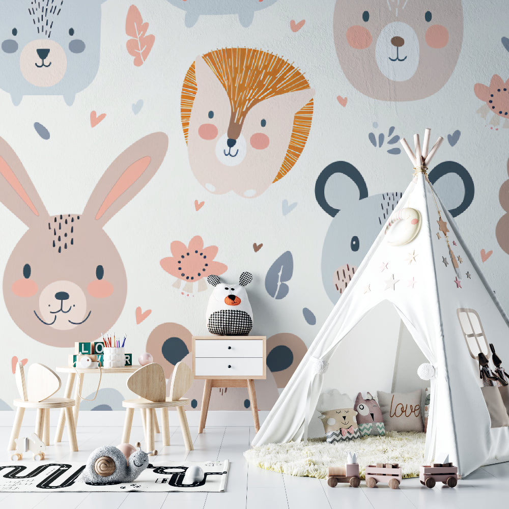 Woodland nursery wallpaper in modern baby room with minimalist white crib and pastel accessories