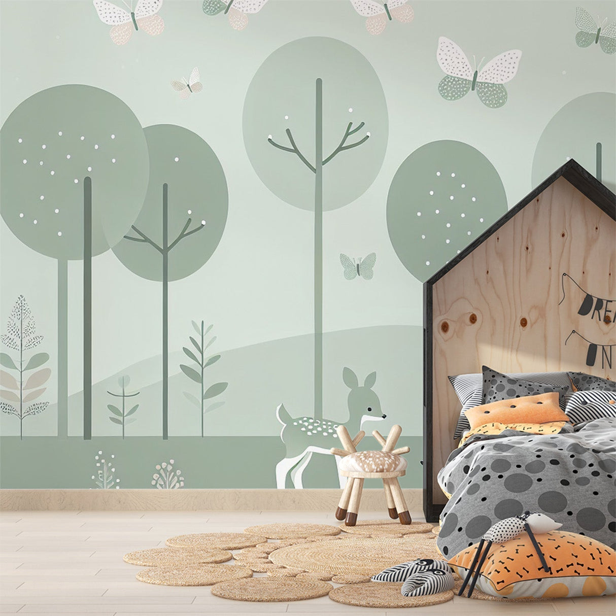 Forest animals wallpaper in a cozy nursery with sage green deer and butterflies design creating a peaceful atmosphere