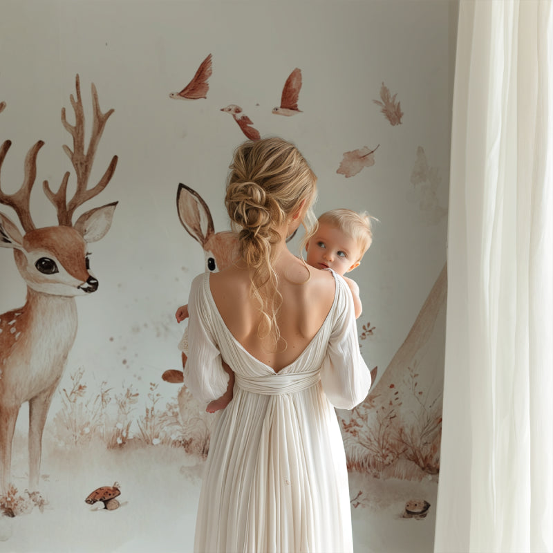 Woodland nursery wall mural in Scandinavian-style baby room