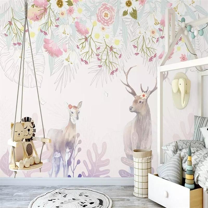 Enchanted deer wallpaper in a girl's bedroom with pink accents and natural light