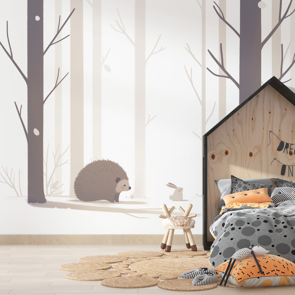 Forest animals wallpaper creating a cozy atmosphere in a modern nursery with white furniture and natural wood accents