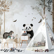 Forest animals wallpaper in cozy nursery with white furniture, showing panda and woodland creatures in soft morning light
