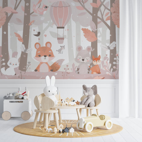 Forest Animals Wallpaper in a soft pink nursery with rocking chair and white furniture