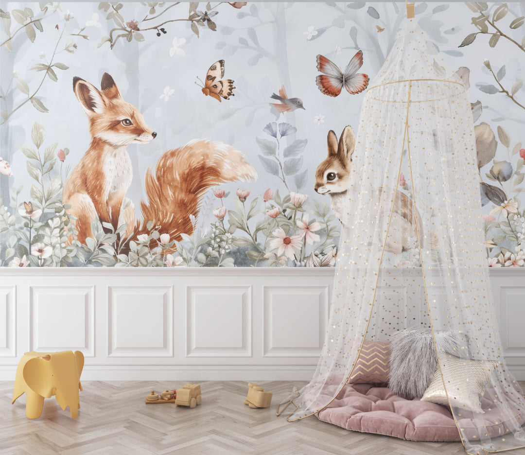 Woodland animals wallpaper creating a cozy atmosphere in a modern nursery with white furniture