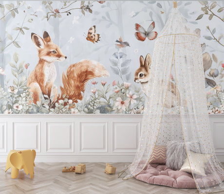 Woodland animals wallpaper creating a cozy atmosphere in a modern nursery with white furniture