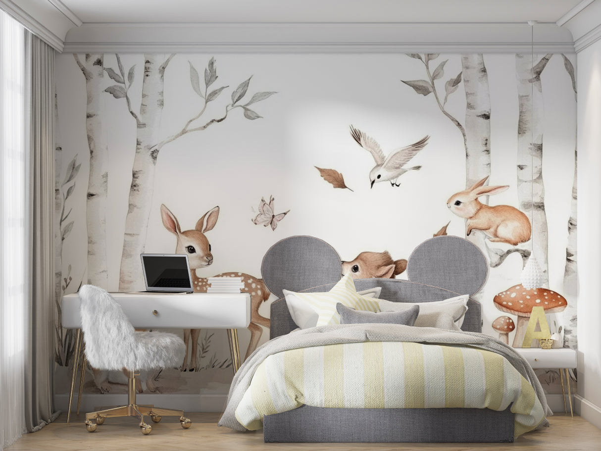 Forest animals wallpaper in a bright nursery with white furniture showing deer and rabbits among birch trees