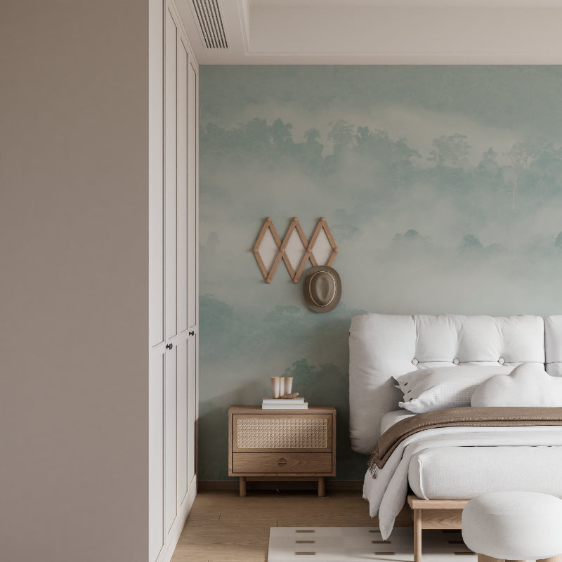 Misty forest wallpaper in modern living room, creating depth with soft mountain landscape and morning fog