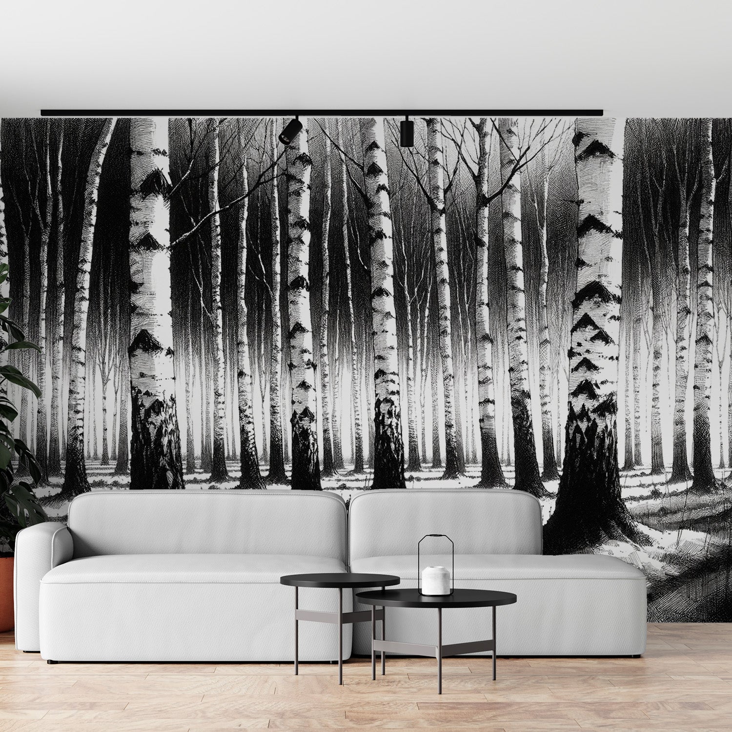 Black and white forest wallpaper creating depth in a modern living room with minimal furniture and natural light