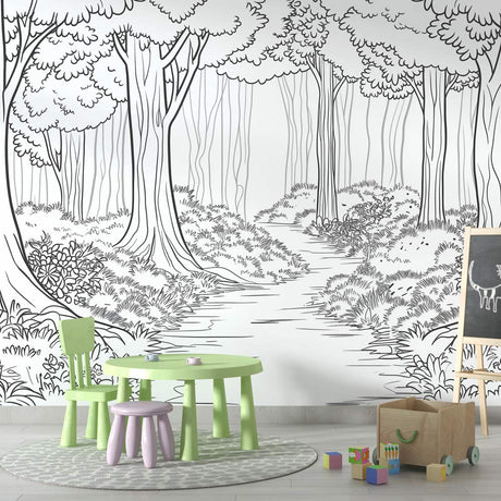 Black and white forest path wallpaper creating depth in a modern living room with minimal furniture