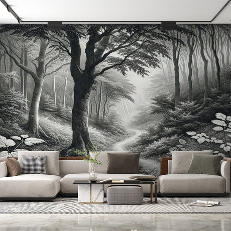 Black and white forest path mural wallpaper in a minimalist living room creating depth and atmosphere