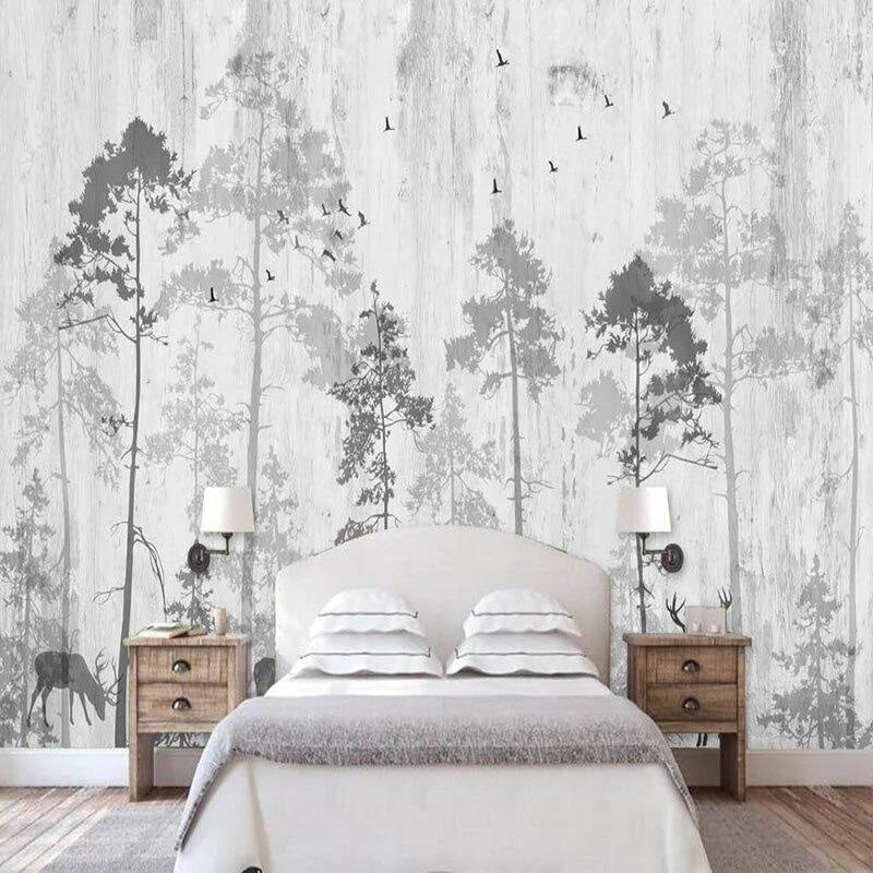 Pine tree wall mural creating depth in a cozy bedroom setting