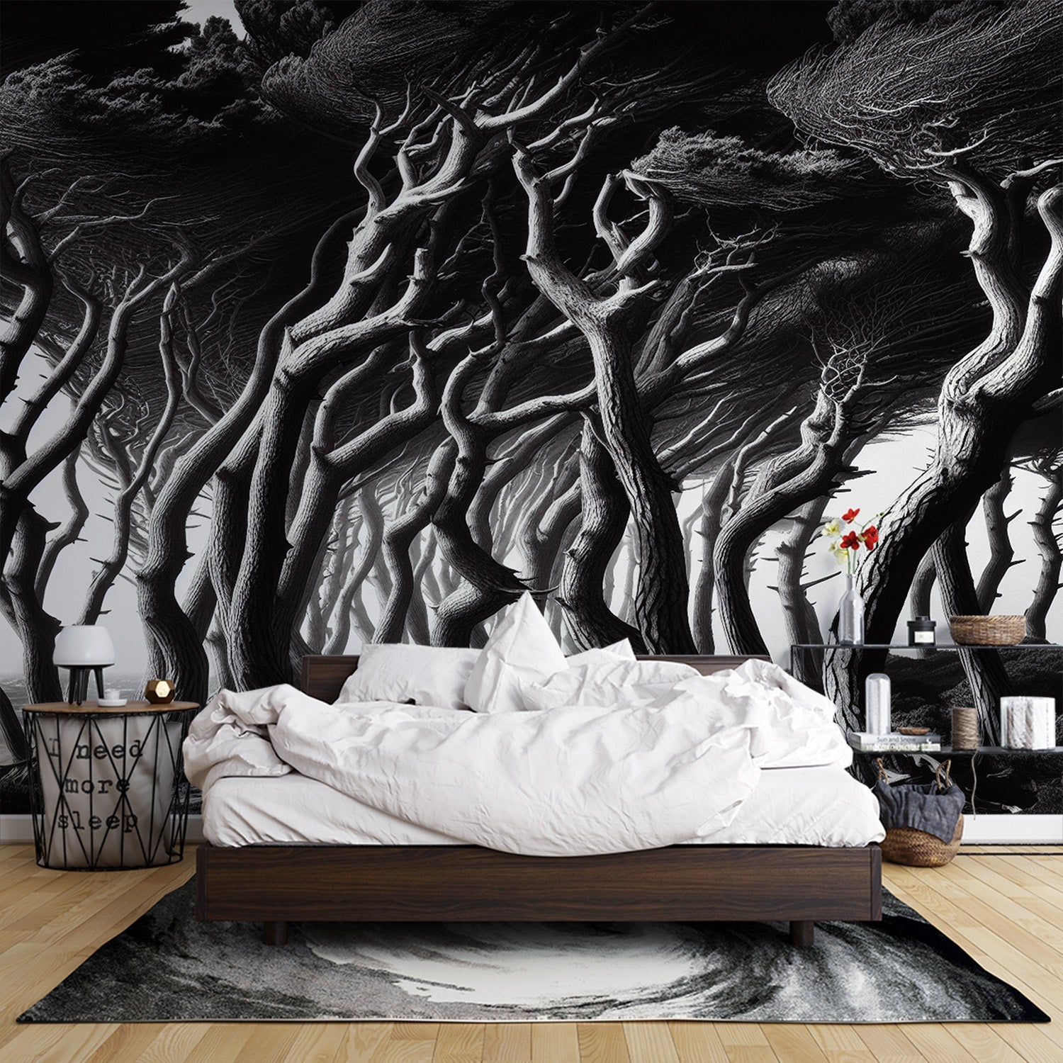 Black and white forest wallpaper creating depth in a modern living room with minimalist furniture