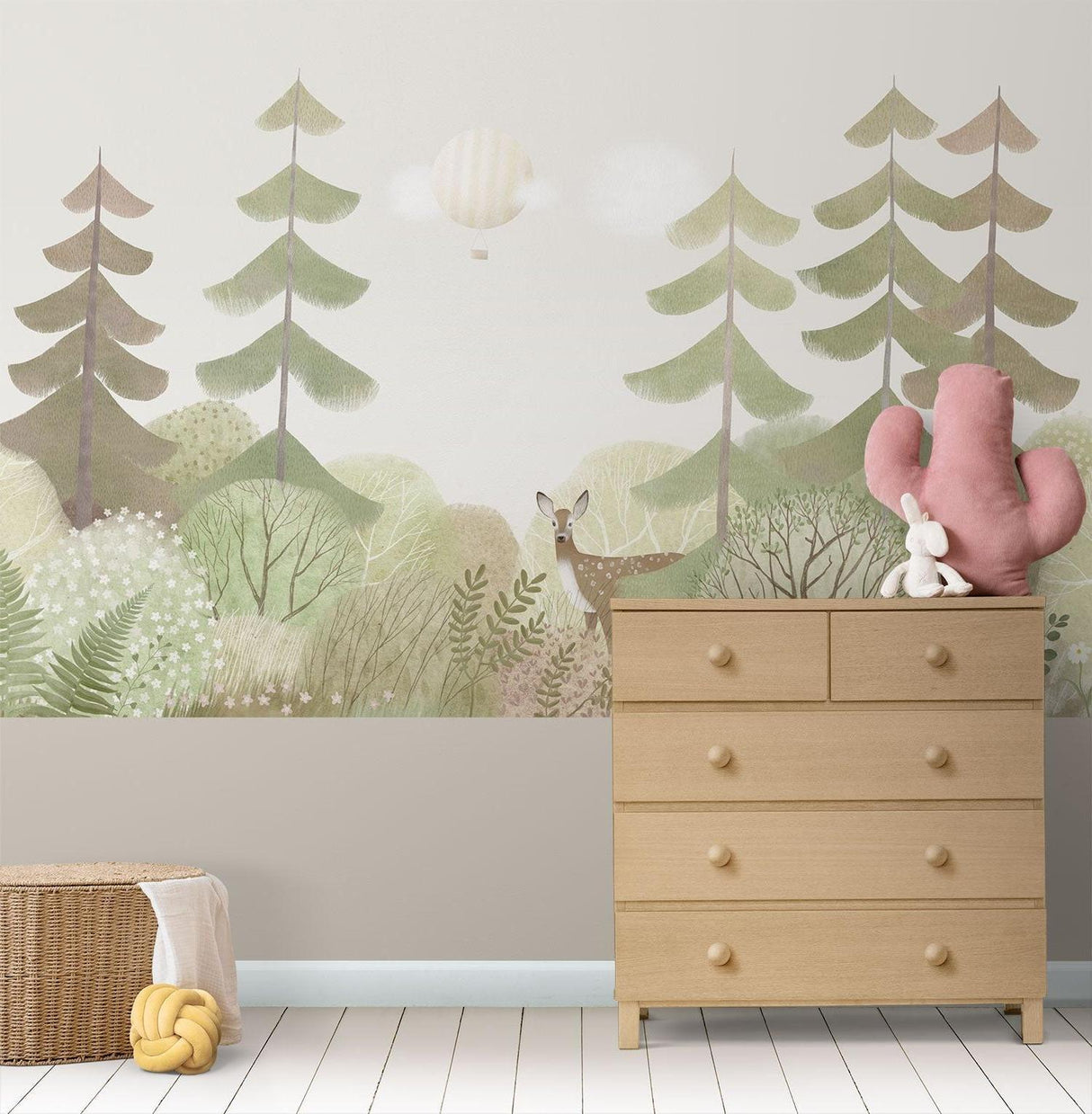 Woodland wallpaper creating a serene atmosphere in a baby's nursery