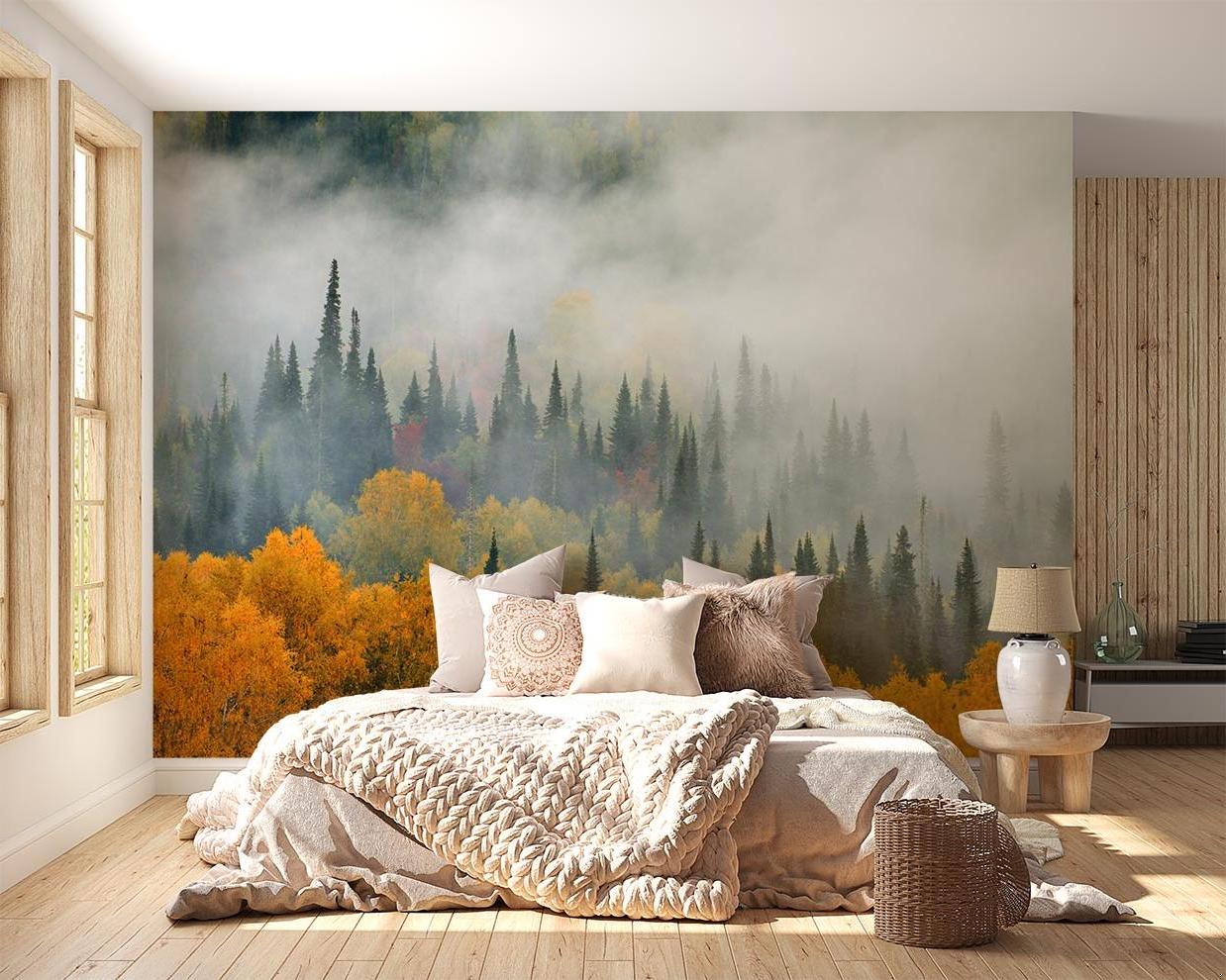 Forest wall mural in modern living room showing misty pine trees and autumn colors creating depth