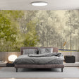 Forest wallpaper mural in modern living room showing misty pine trees creating depth and atmosphere